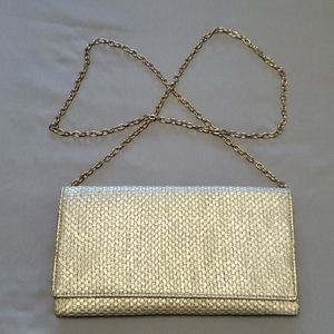 Sondra Roberts gold clutch.